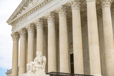 Corinthian columns and the Authority of Law statue at the west entrance of the United States Supreme Court in Washington, D.C., where petitions to review the prediction market sports contract cases are pending